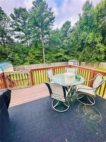 a view of a chairs and table in the roof