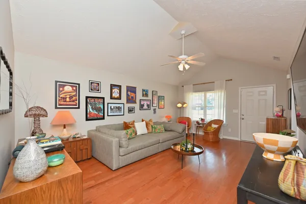 a living room with furniture and a flat screen tv