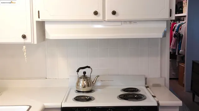 a room with wooden floor and pool table