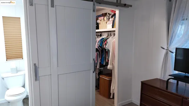 a view of storage and utility room with racks on the wall