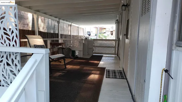 a view of a house with wooden deck