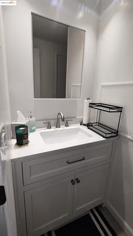 a bedroom with a bed and a mirror