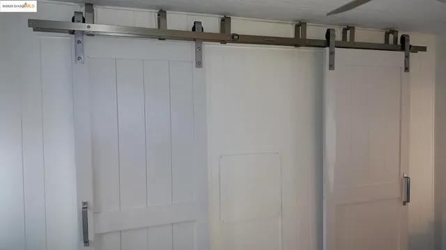 a white toilet sitting next to a shower