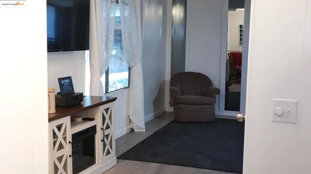 a view of livingroom with furniture and wooden floor