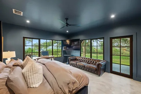 a bed room with two beds and a large window
