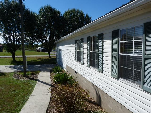 4829 Asbury Road Manchester, TN 37355 - Photo 3 of 29 a house view with a garden space