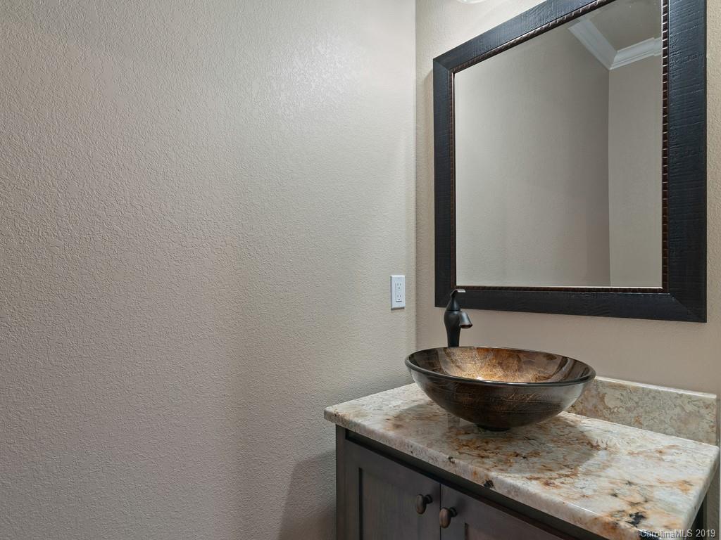 28 Jasper Ridge Clyde, NC 28721 - Photo 12 of 24 a close view of a sink and a mirror