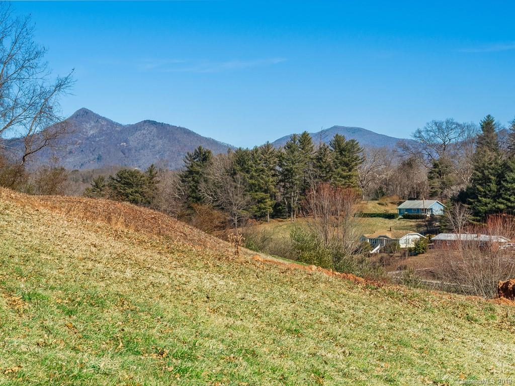 28 Jasper Ridge Clyde, NC 28721 - Photo 24 of 24 a view of a dry yard with mountains in the background