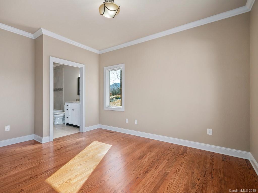 28 Jasper Ridge Clyde, NC 28721 - Photo 9 of 24 wooden floor in an empty room with a window