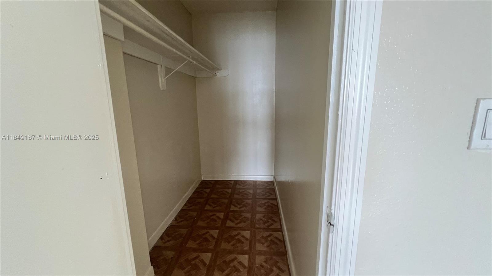 486 Northwest 165th Street, Unit B606 Miami, FL 33169 - Photo 16 of 19 a view of a hallway
