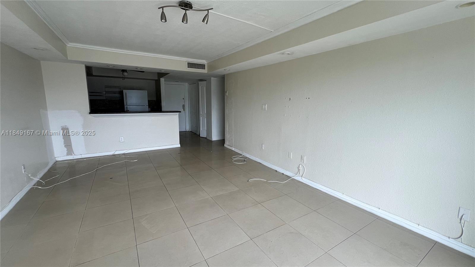 486 Northwest 165th Street, Unit B606 Miami, FL 33169 - Photo 8 of 19 a view of a big room with windows