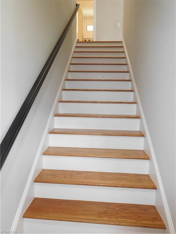 7805 Grapevine Road Lewisville, NC 27023 - Photo 22 of 45 ALL WOODEN STAIRS. NO CARPET IN THIS HOME.