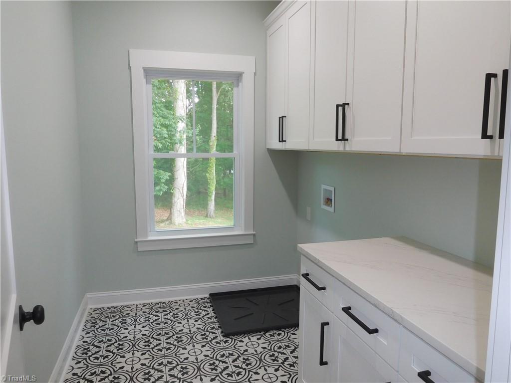 7805 Grapevine Road Lewisville, NC 27023 - Photo 35 of 45 LARGE WALK-IN LAUNDRY ROOM LOCATED ON THE 2ND FLOOR.