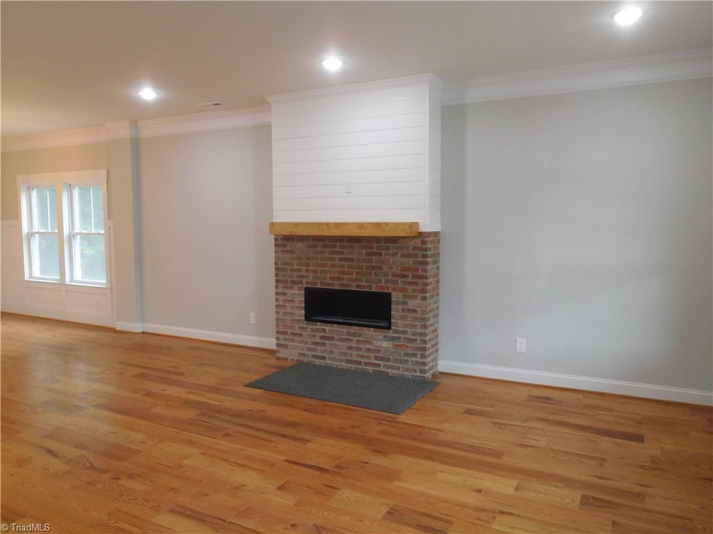 7805 Grapevine Road Lewisville, NC 27023 - Photo 45 of 45 MAIN LEVEL HAS AN OPEN FLOOR PLAN. ABSOLUTELY BEAUTIFUL HARDWOOD FLOORING THROUGHOUT ENTIRE HOME. LIVING ROOM FLOWS INTO THE DINING ROOM & KITCHEN. BRICK FIREPLACE. THIS HOME IS SET UP TO ENTERTAIN IN.