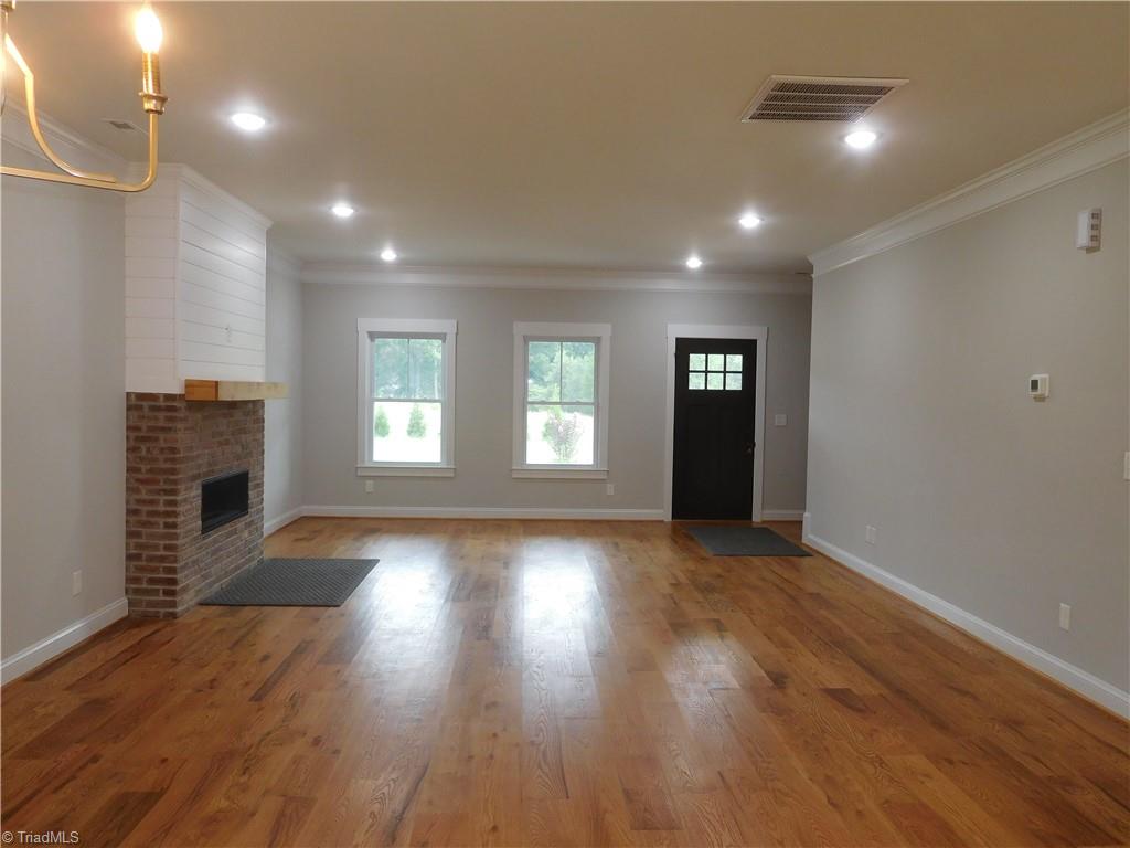 7805 Grapevine Road Lewisville, NC 27023 - Photo 5 of 45 LIVING ROOM. PLENTY OF NATURAL LIGHT THROUGHOUT HOME.