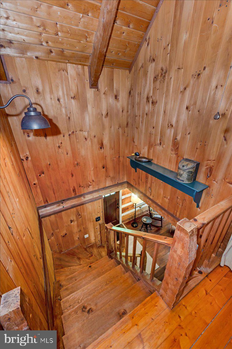 16926 Sprecher Road Sharpsburg, MD 21782 - Photo 22 of 76 Rustic wooden staircase invites warmth.