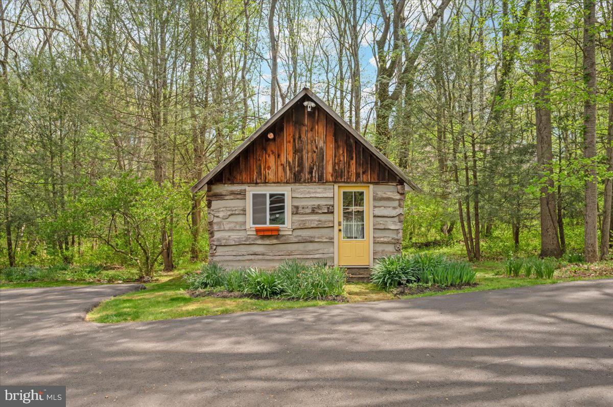 16926 Sprecher Road Sharpsburg, MD 21782 - Photo 59 of 76 Charming cabin nestled in lush greenery.