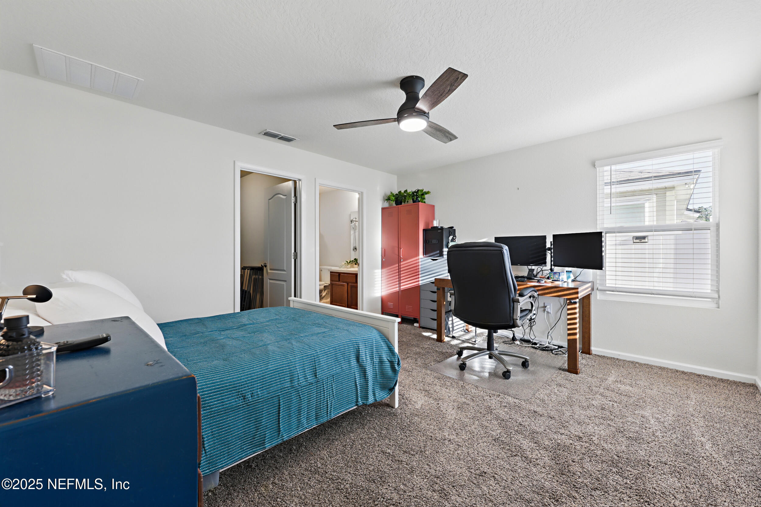 8328 Cape Fox Drive Jacksonville, FL 32222 - Photo 16 of 34 a bedroom with a workspace