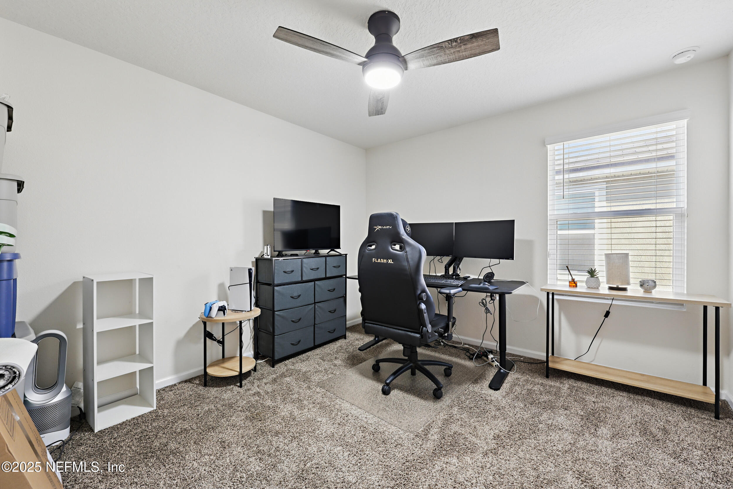 8328 Cape Fox Drive Jacksonville, FL 32222 - Photo 21 of 34 a view of a workspace with furniture and a window