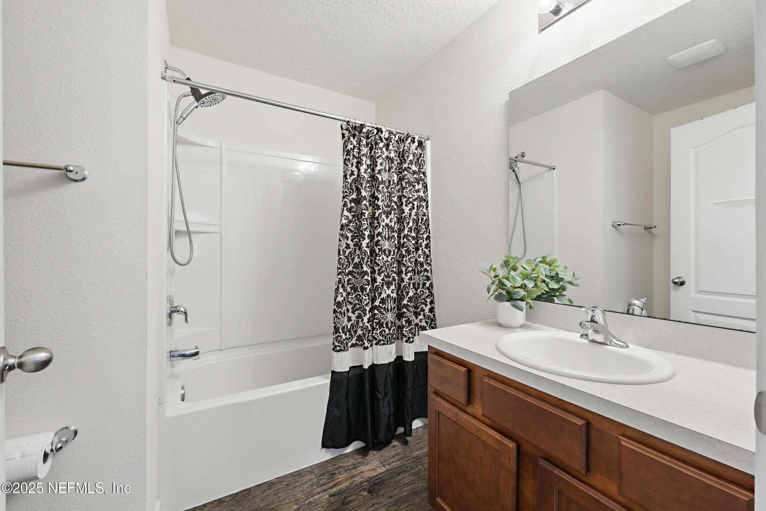 8328 Cape Fox Drive Jacksonville, FL 32222 - Photo 22 of 34 a bathroom with a sink and a bathtub