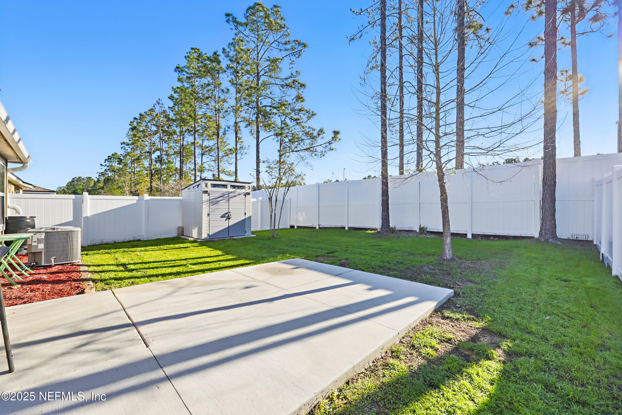 8328 Cape Fox Drive Jacksonville, FL 32222 - Photo 25 of 34 a view of a backyard with wooden fence