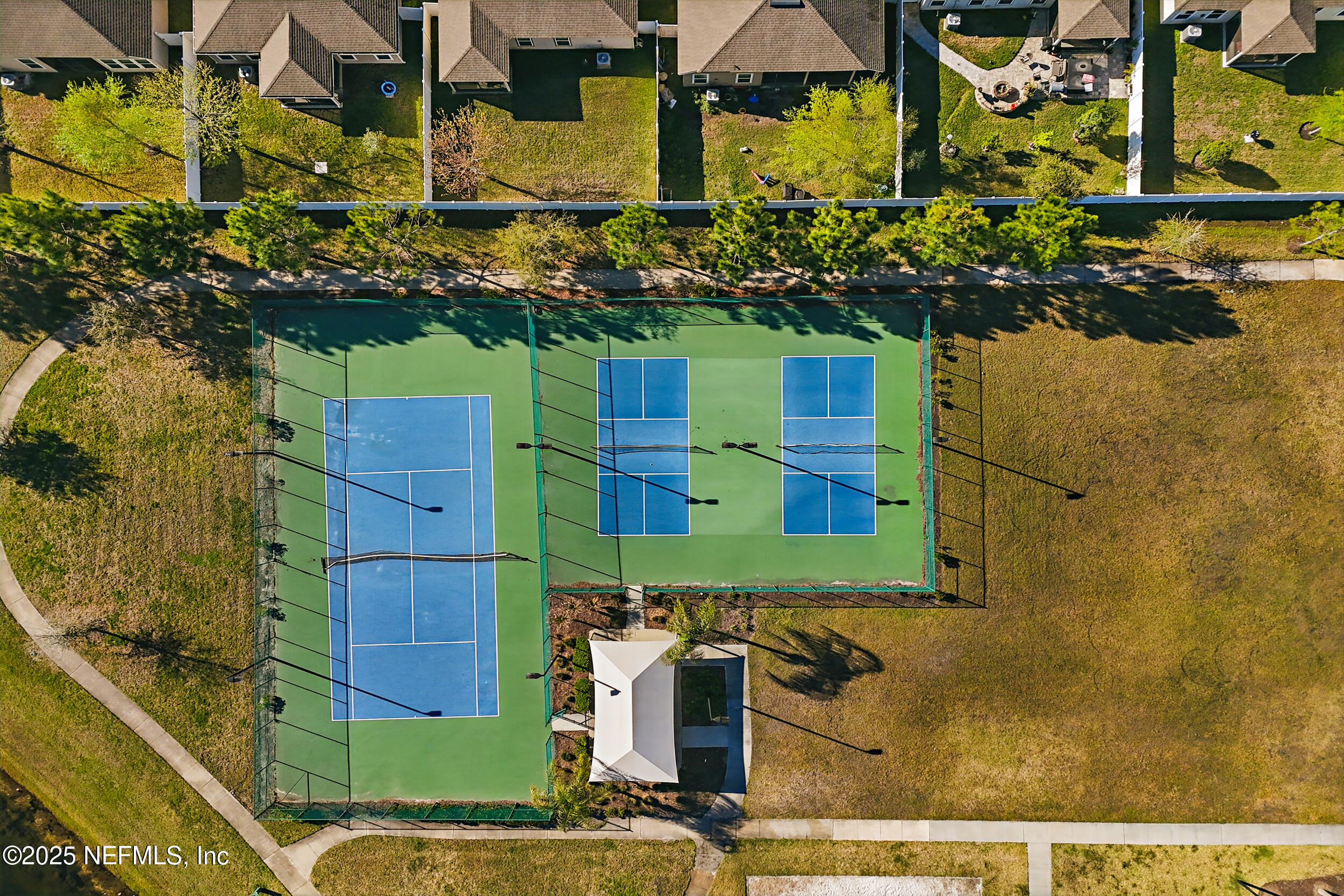 8328 Cape Fox Drive Jacksonville, FL 32222 - Photo 34 of 34 an aerial view of a houses with yard