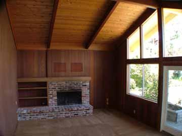 16 Azalea Drive Mill Valley, CA 94941 - Photo 4 of 9 a living room with furniture a fireplace and a floor to ceiling window