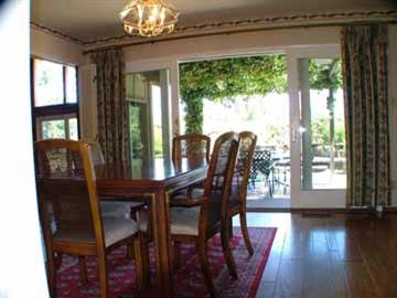 16 Azalea Drive Mill Valley, CA 94941 - Photo 5 of 9 a dining room with furniture a chandelier and wooden floor