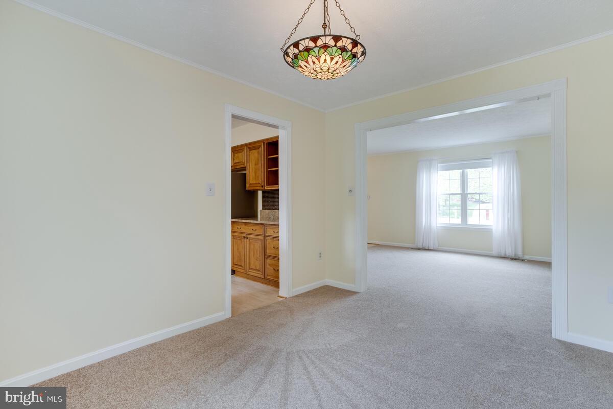 6456 Skipton Drive Hanover, MD 21076 - Photo 12 of 75 Dining room view into living room