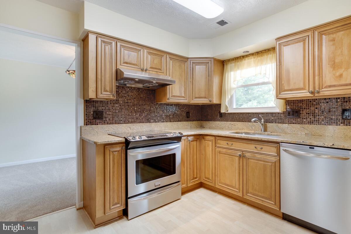 6456 Skipton Drive Hanover, MD 21076 - Photo 17 of 75 Sink overlooks deck and back yard