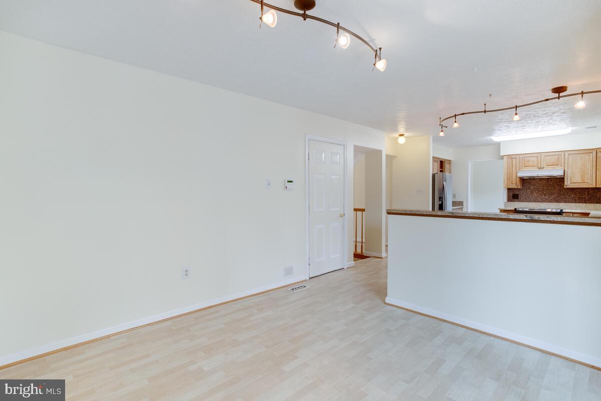 6456 Skipton Drive Hanover, MD 21076 - Photo 22 of 75 View from sunroom to family/kitchen