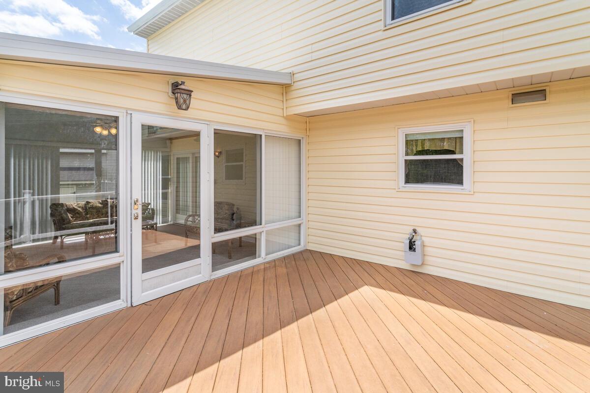 6456 Skipton Drive Hanover, MD 21076 - Photo 29 of 75 Deck view of sunroom