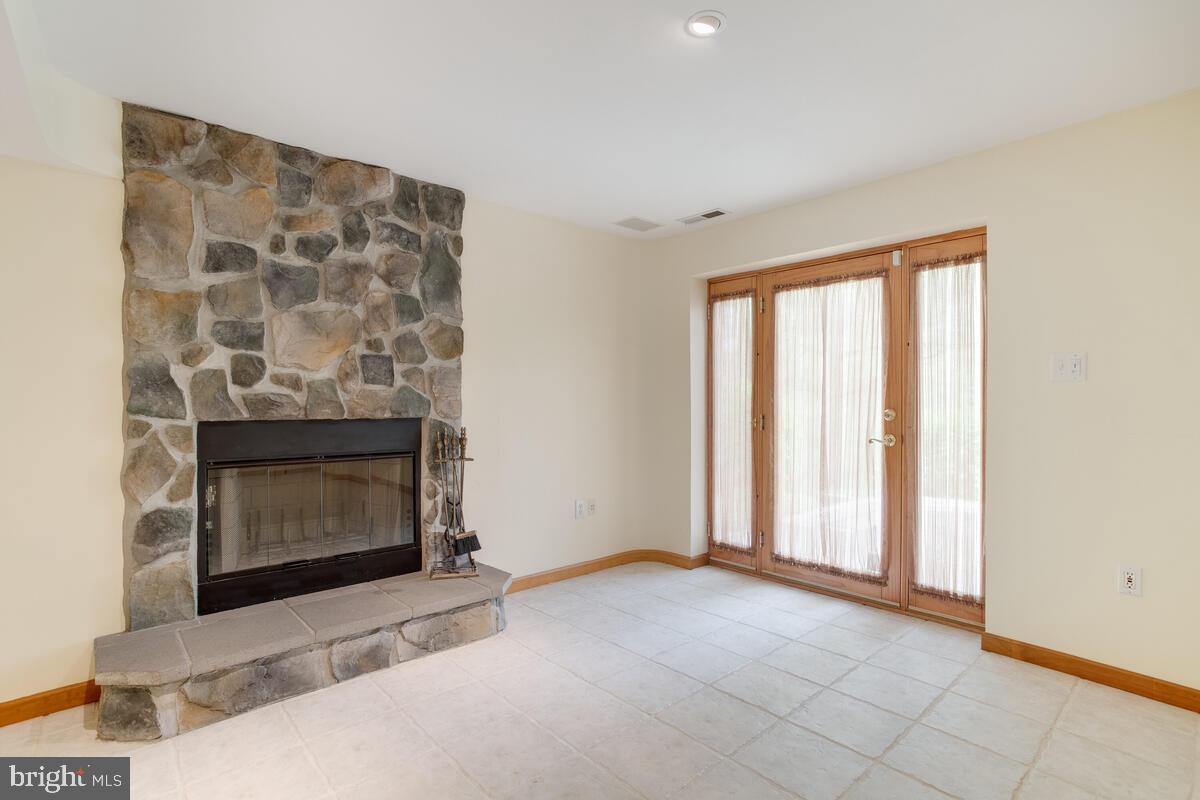 6456 Skipton Drive Hanover, MD 21076 - Photo 51 of 75 Wood burning fireplace with stone hearth