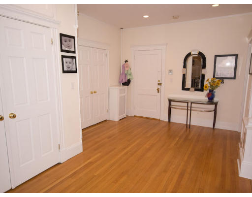 16 Claflin Road, Unit 2 Brookline, MA 02445 - Photo 2 of 10 a view of a bedroom with a bed and wooden floor