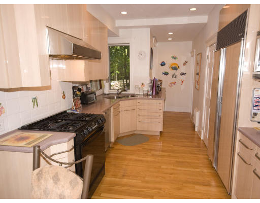 16 Claflin Road, Unit 2 Brookline, MA 02445 - Photo 3 of 10 a kitchen with stainless steel appliances granite countertop a stove a sink and a refrigerator
