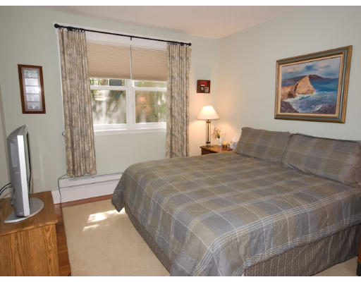 16 Claflin Road, Unit 2 Brookline, MA 02445 - Photo 6 of 10 a bedroom with a bed and a window