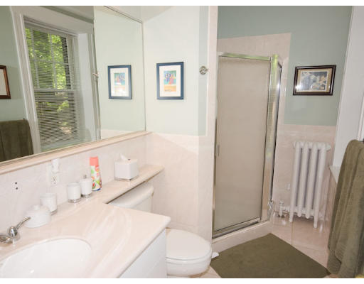 16 Claflin Road, Unit 2 Brookline, MA 02445 - Photo 8 of 10 a bathroom with a bathtub and a window