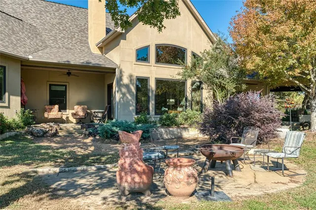 a front view of a house with sitting area