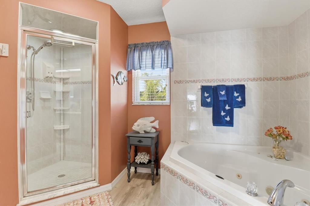 2882 North Comanche Point Crystal River, FL 34429 - Photo 15 of 39 a bathroom with a tub sink and mirror