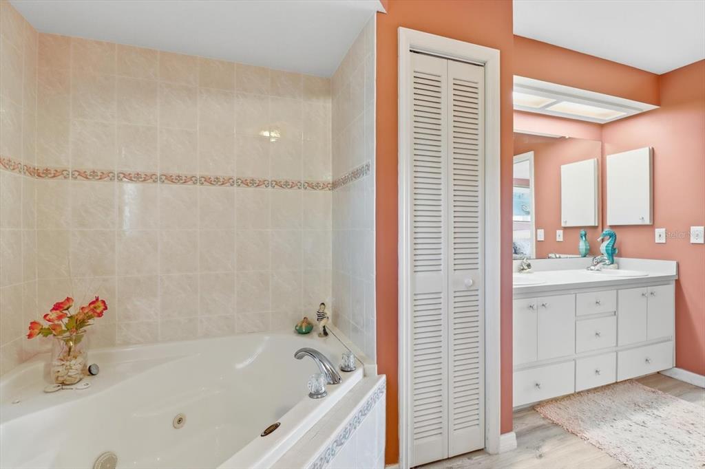 2882 North Comanche Point Crystal River, FL 34429 - Photo 16 of 39 a bathroom with a tub sink and mirror