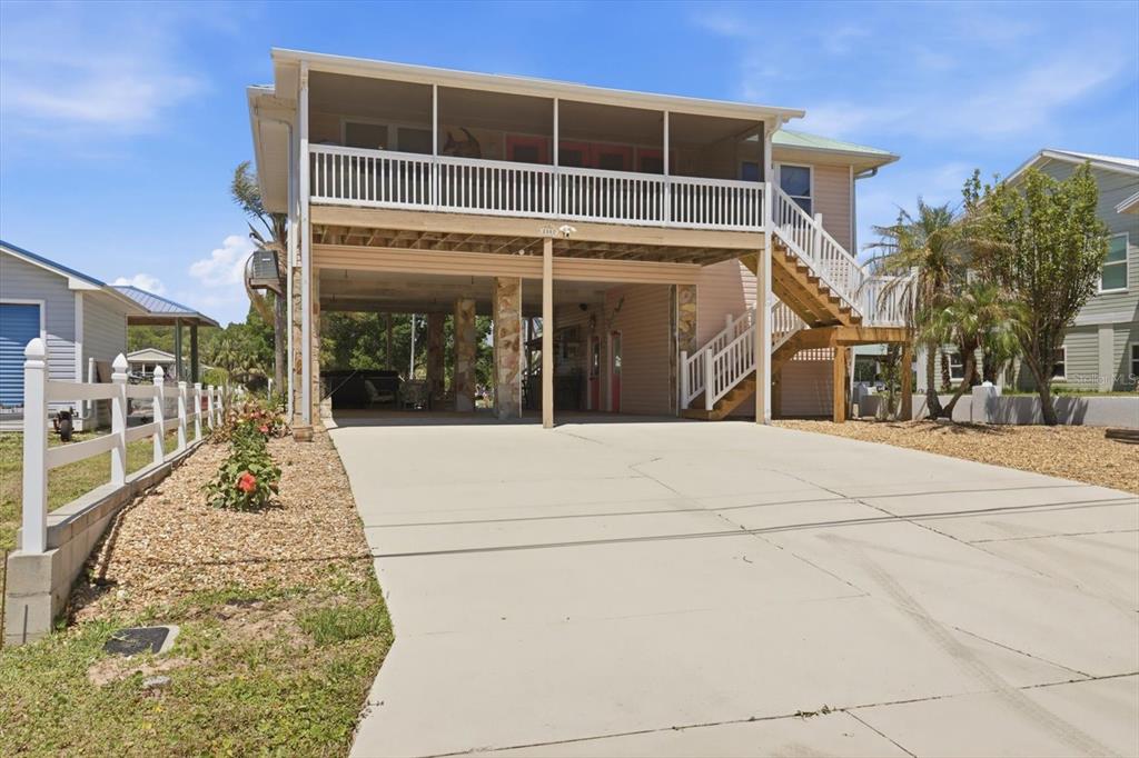 2882 North Comanche Point Crystal River, FL 34429 - Photo 2 of 39 a view of a building with a street