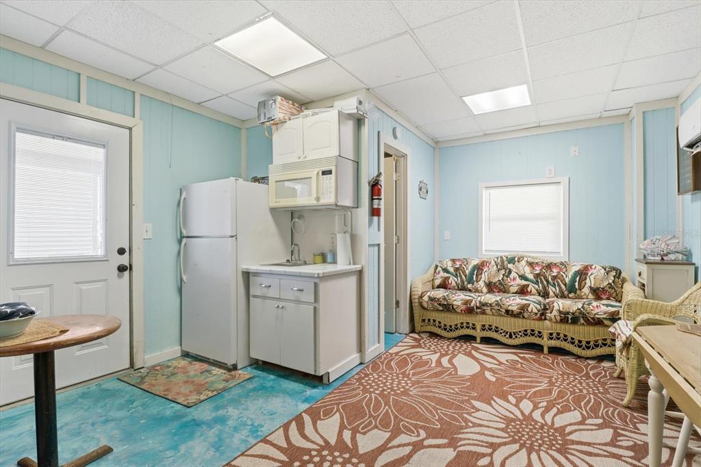 2882 North Comanche Point Crystal River, FL 34429 - Photo 23 of 39 a bedroom with a bed and a refrigerator