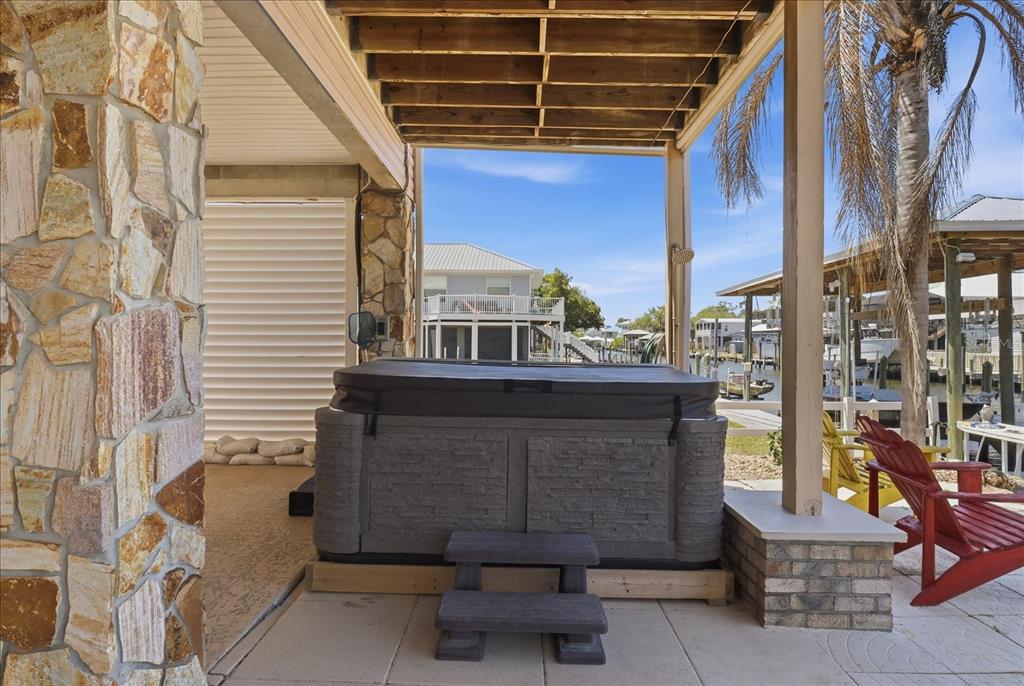 2882 North Comanche Point Crystal River, FL 34429 - Photo 24 of 39 a view of a patio with a table and chairs