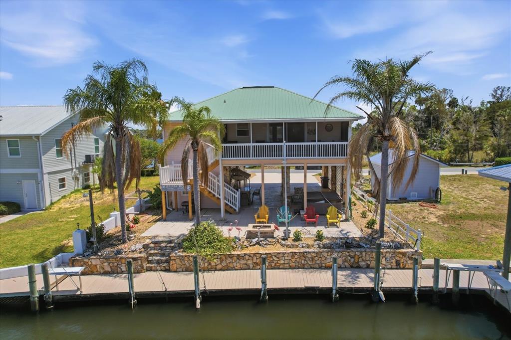 2882 North Comanche Point Crystal River, FL 34429 - Photo 30 of 39 a front view of house with yard swimming pool and outdoor seating
