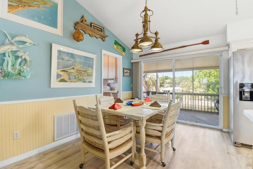 2882 North Comanche Point Crystal River, FL 34429 - Photo 5 of 39 a view of a dining room with furniture a chandelier and wooden floor
