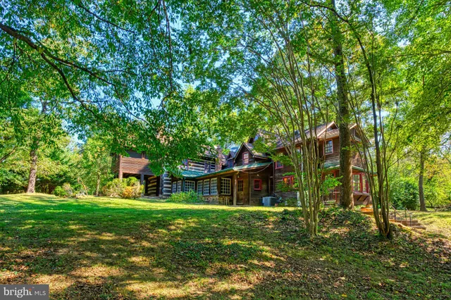 a large yard with lots of green space and trees