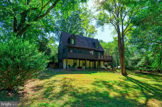 a house with swimming pool in front of it