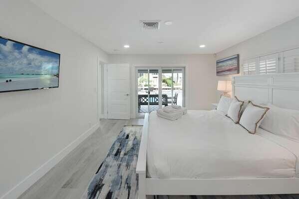 839 Enfield Street Boca Raton, FL 33487 - Photo 10 of 36 a bedroom with a large bed and a window