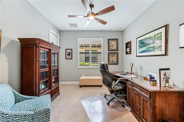 a workspace with furniture and window