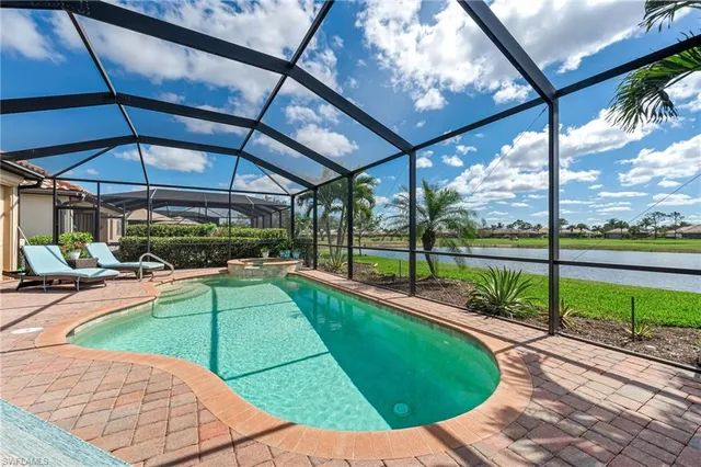 a view of swimming pool with a patio